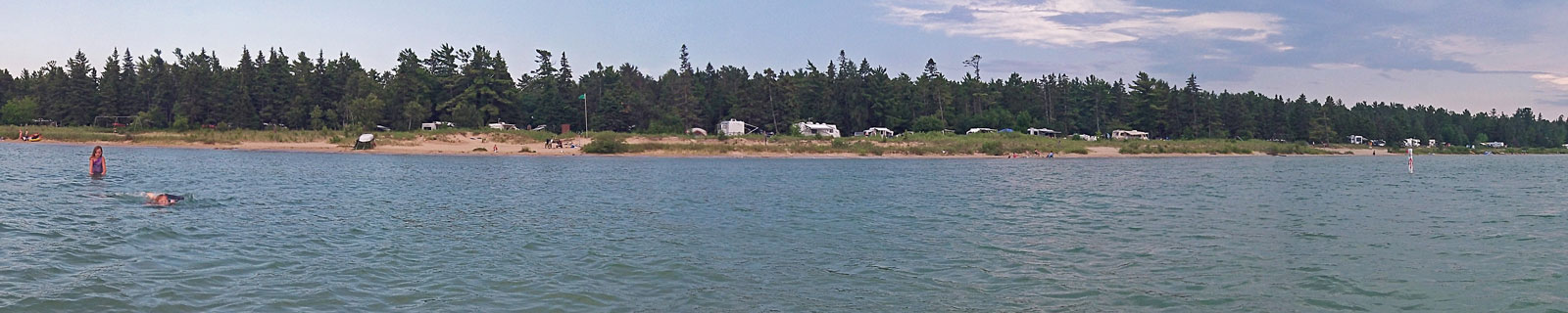 swimming at the lakeshore campground beach at wilderness state park